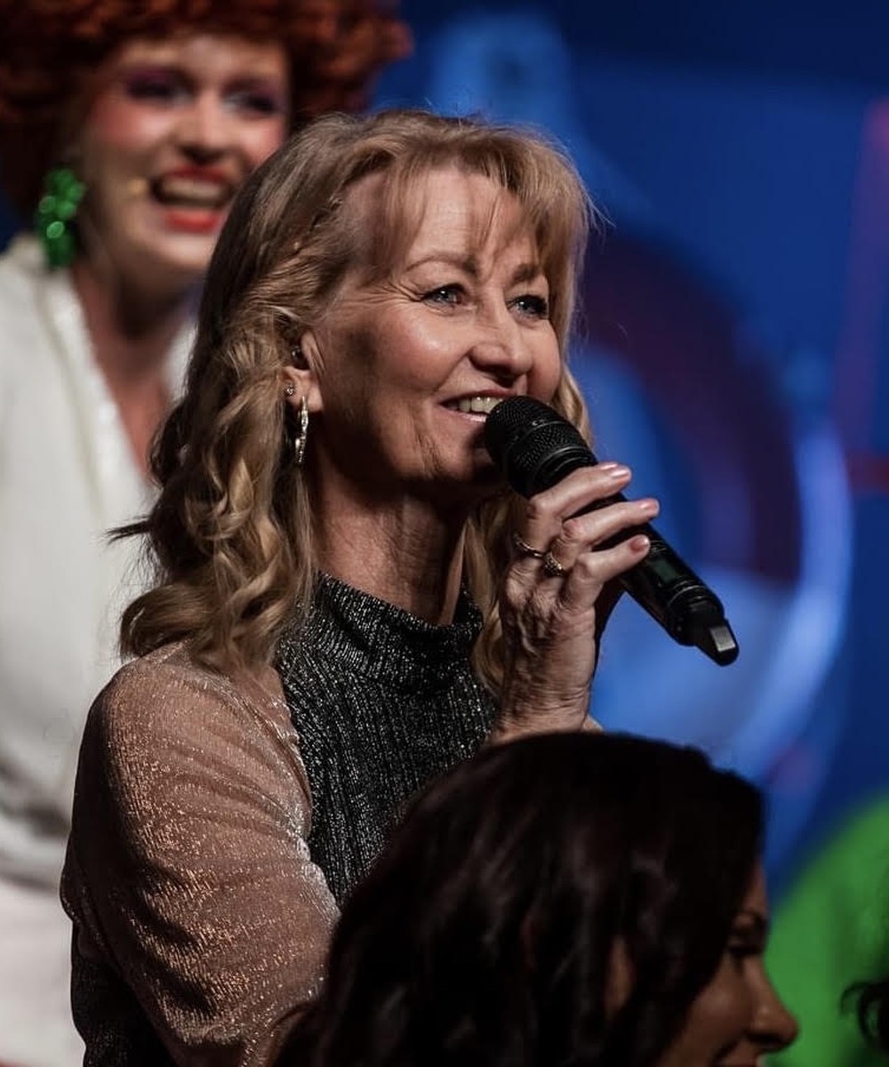 Helen Clague singing on stage